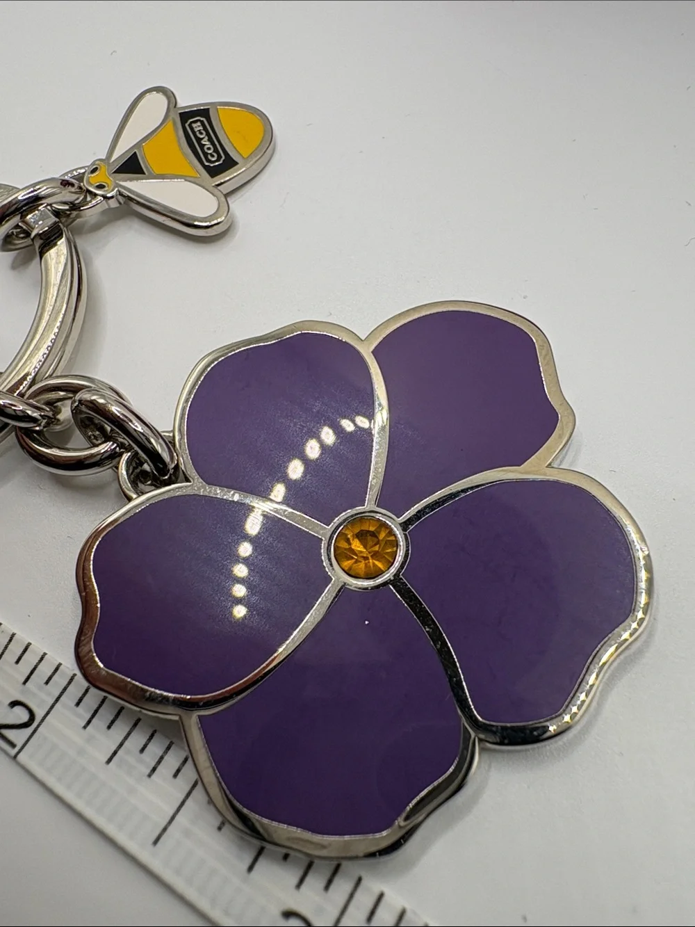 Coach Purple Enamel Flower Keychain with Yellow Bee Accent